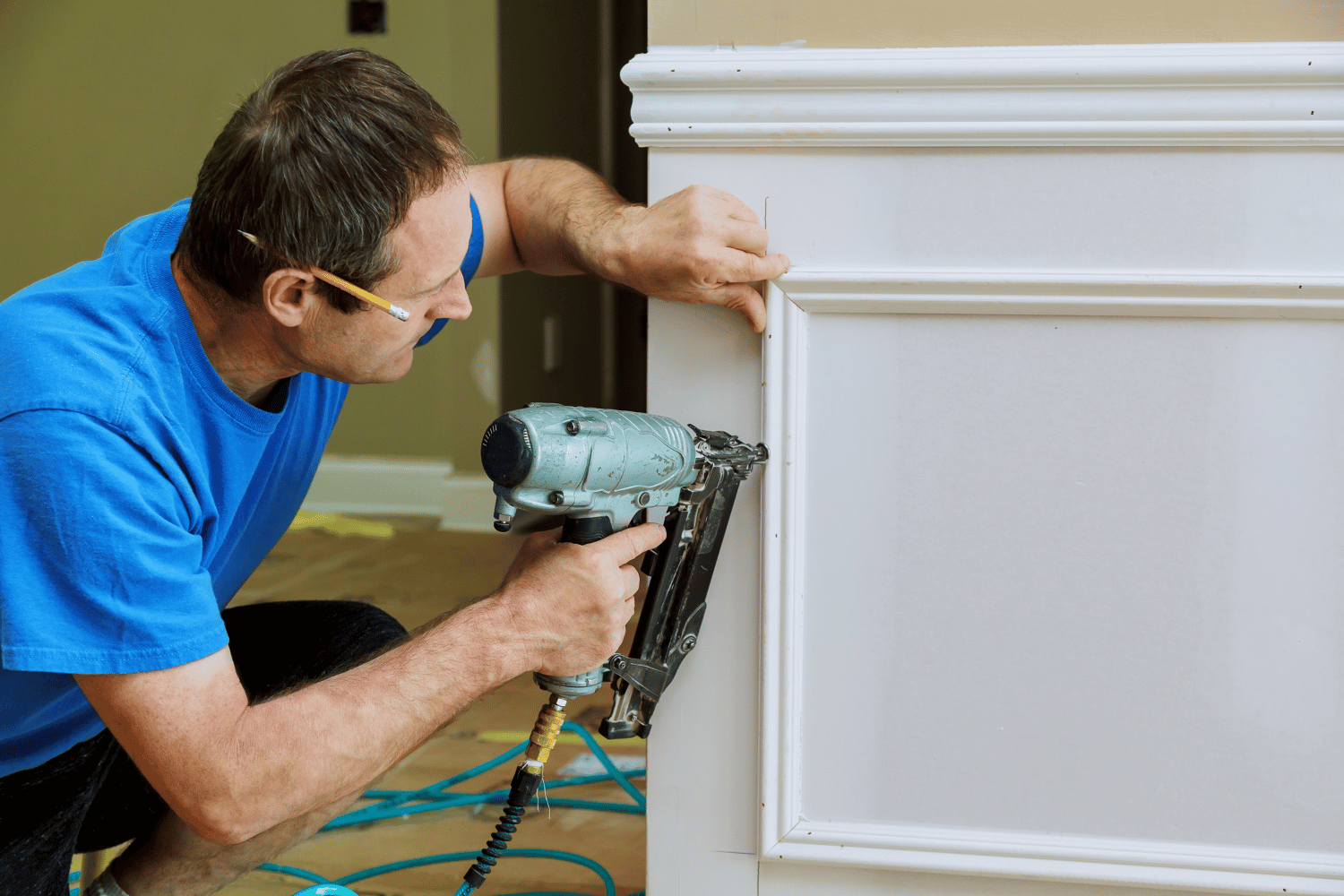 Installing wall trim with a finish nailer