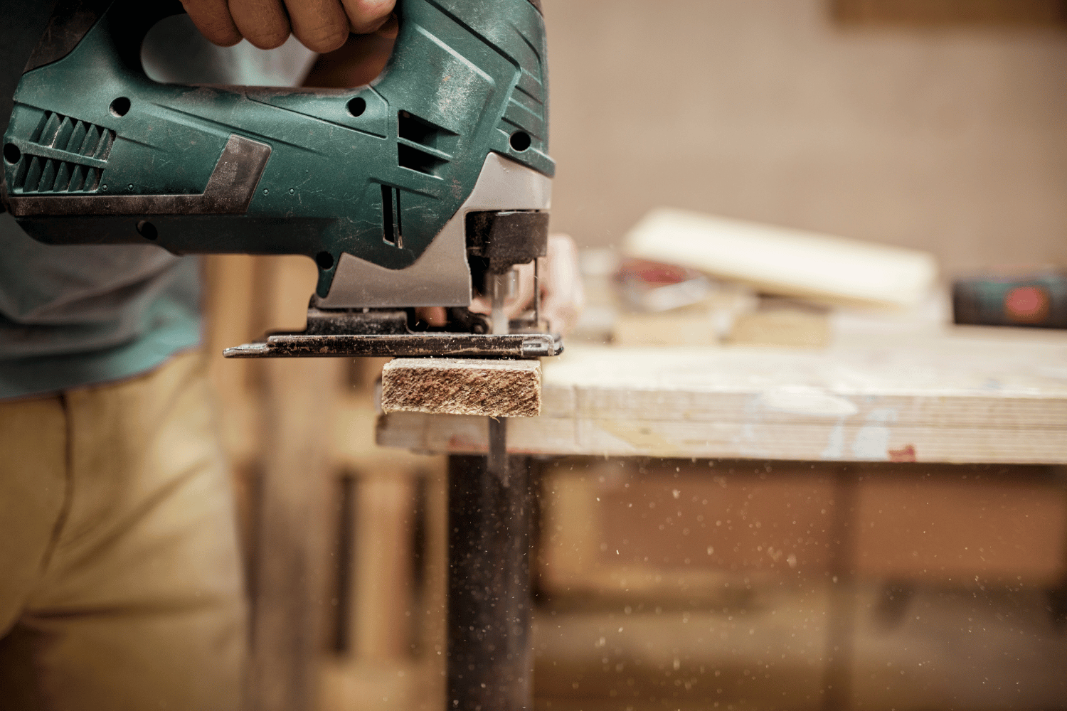 A jigsaw with a saw blade cutting wood