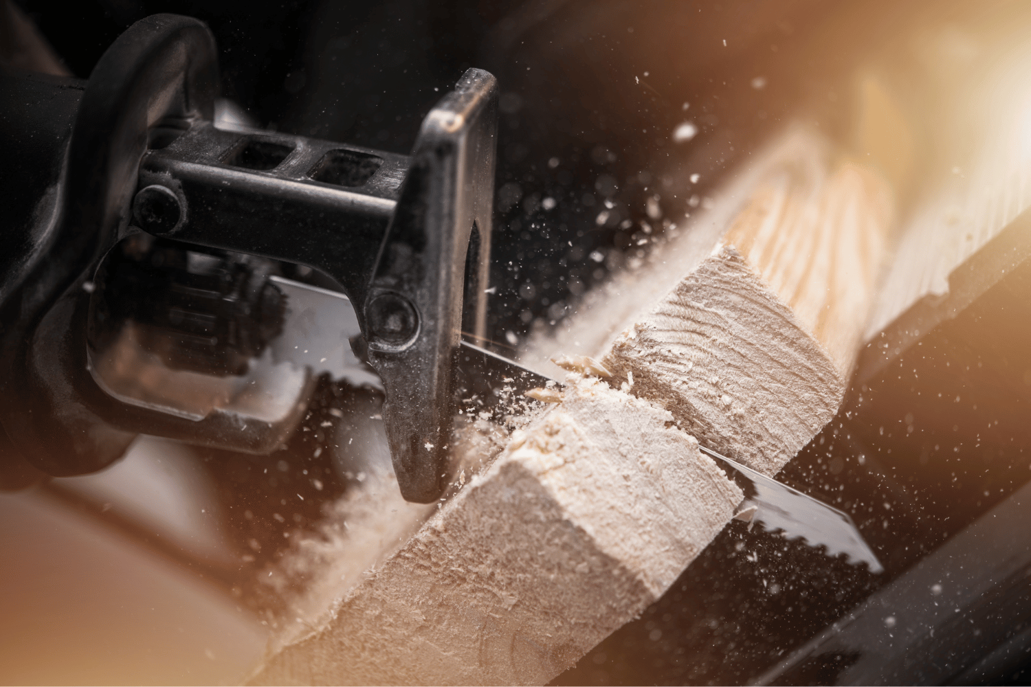 A modern reciprocating saw with a variable speed trigger cuts easily through wood