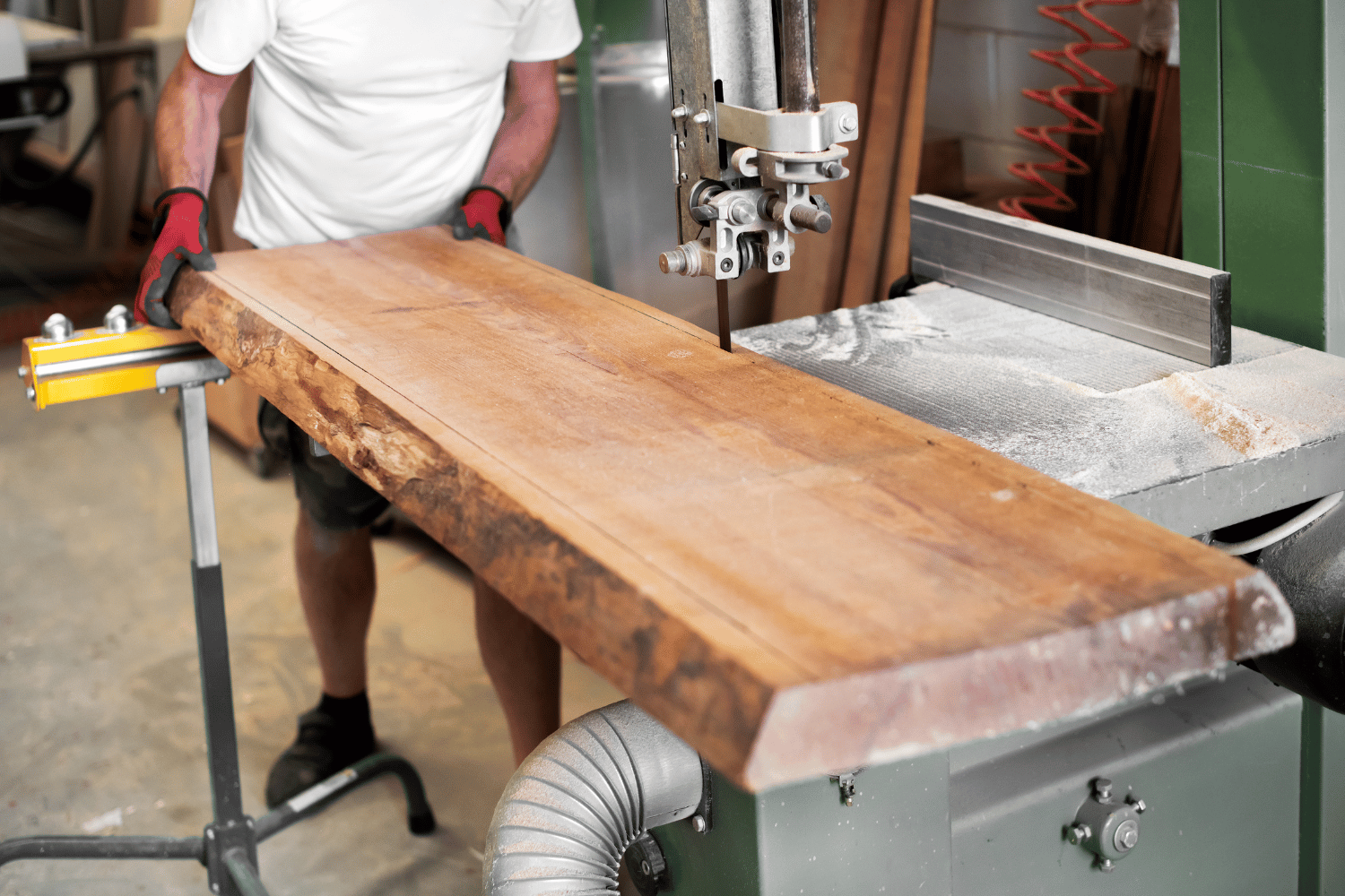 Band Saw cutting live edge off slab of wood.