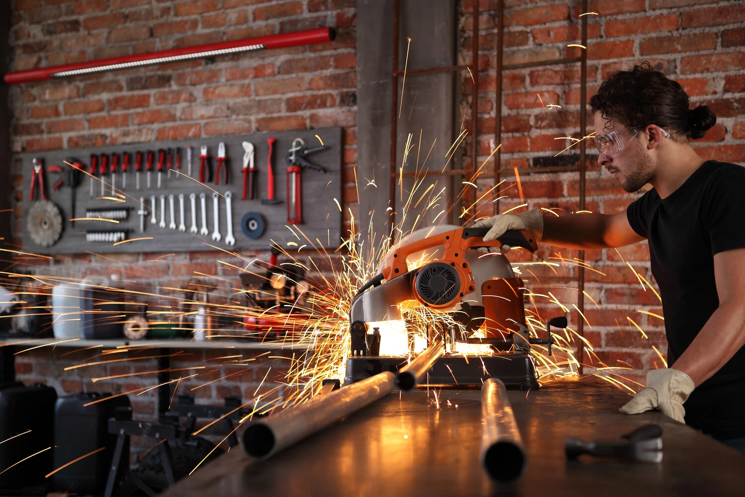 A miter saw cutting metal with a metal cutting blade