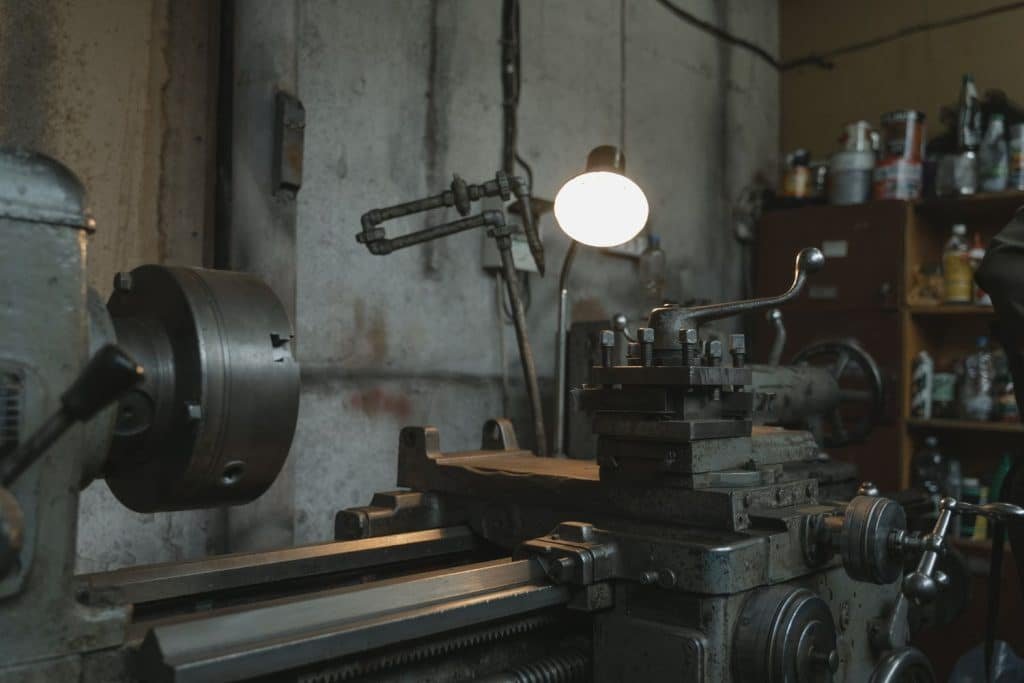 A lathe is a machine tool that creates symmetrical cylindrical pieces