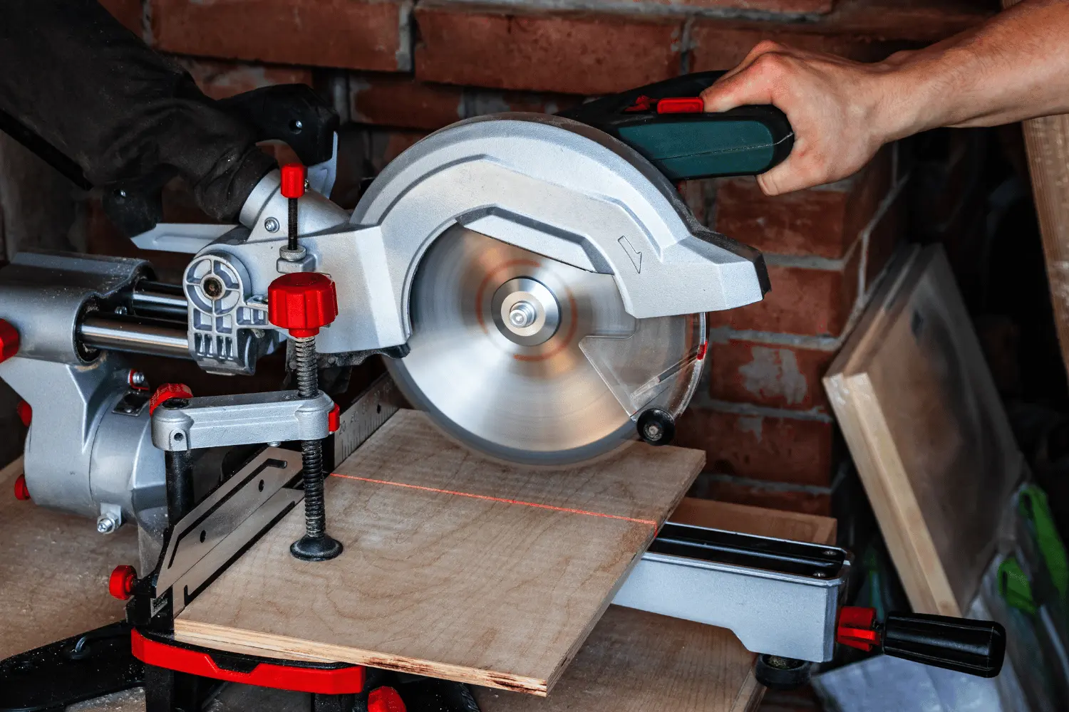 A mitre saw using a laser guide for its cut line.