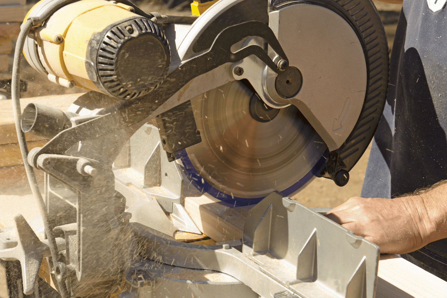 Miter saw being used to cut wood