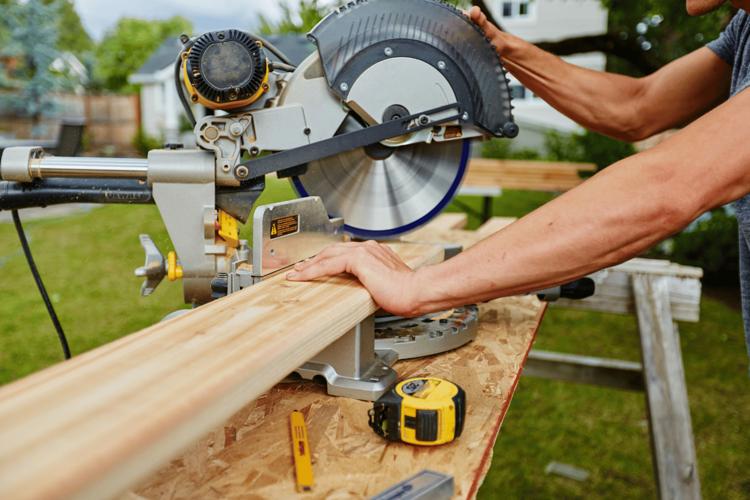 A miter saw cutting wood