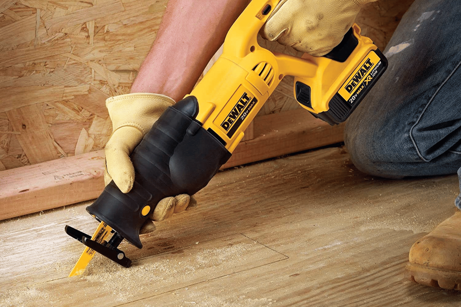 A person holding a reciprocating saw with a wood cutting blade