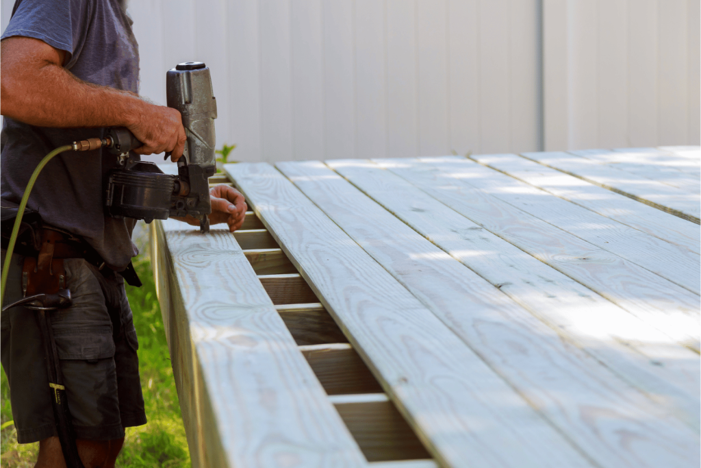 Using a nail gun to install decking