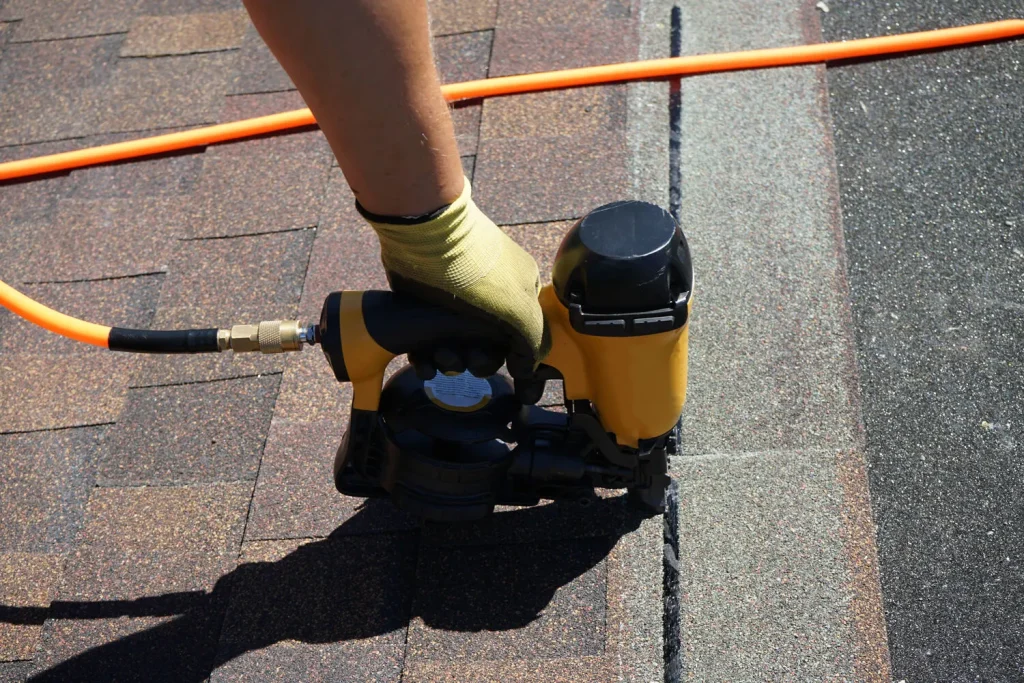 Using a pneumatic roofing nailer to install shingles